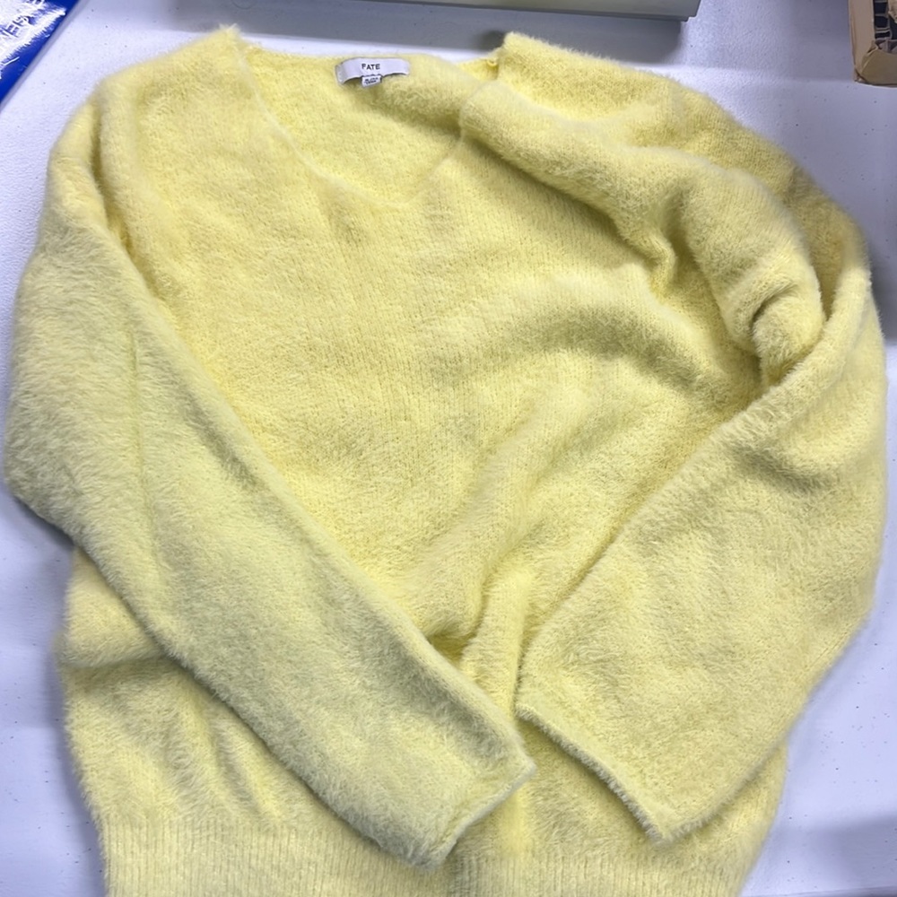 yellow sweater
